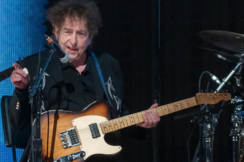 Watch Bob Dylan turn in a rare electric guitar performance as he surprises Farm Aid 2023 with the Heartbreakers backing him